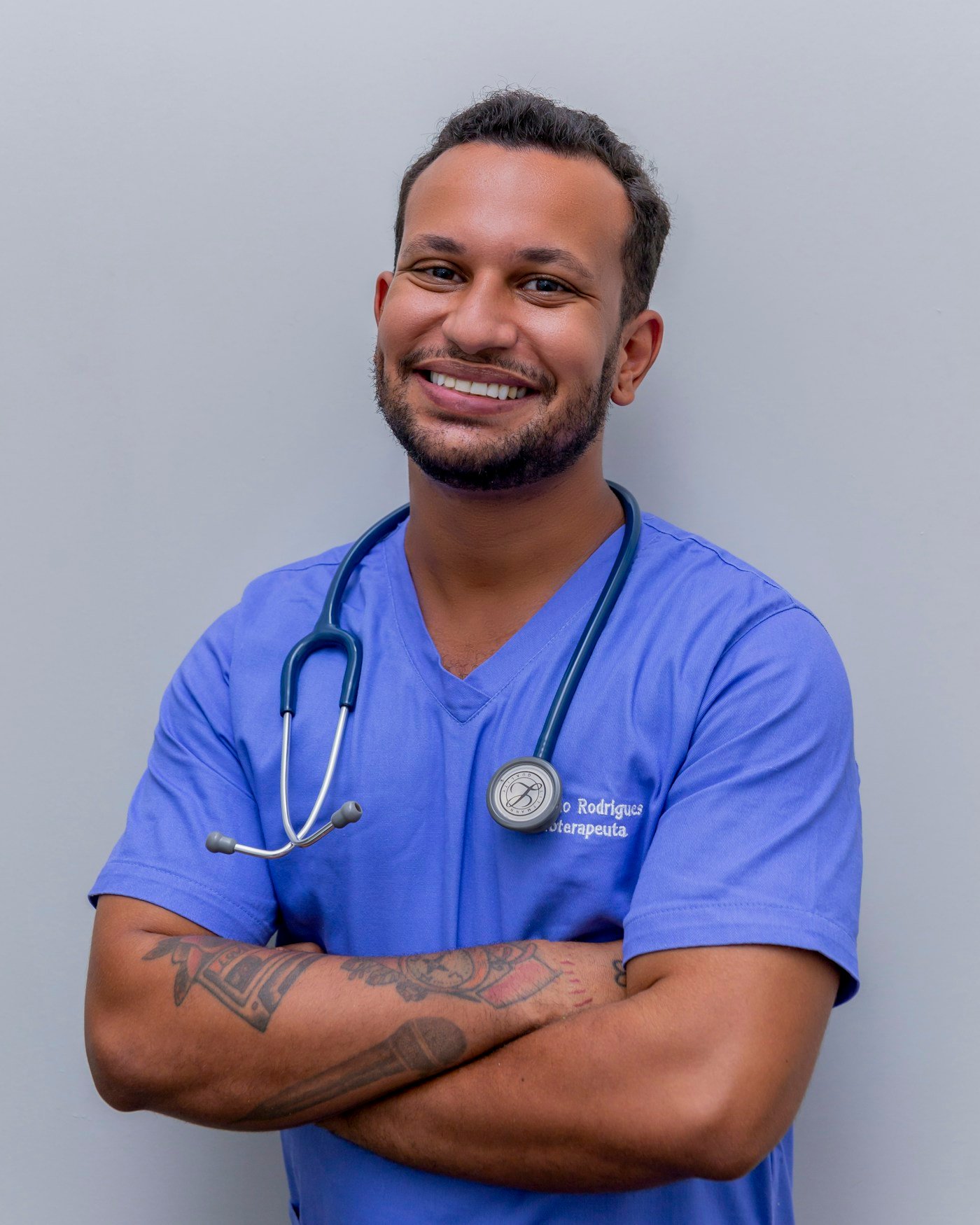 Healthcare professional in scrubs with stethoscope